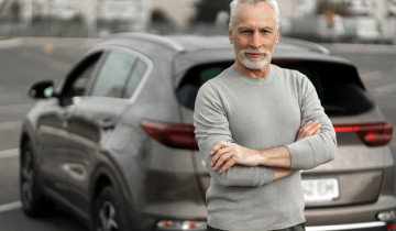 Happy,Senior,Man,Driver,In,Casual,Clothes,,Smiles,Looking,At
